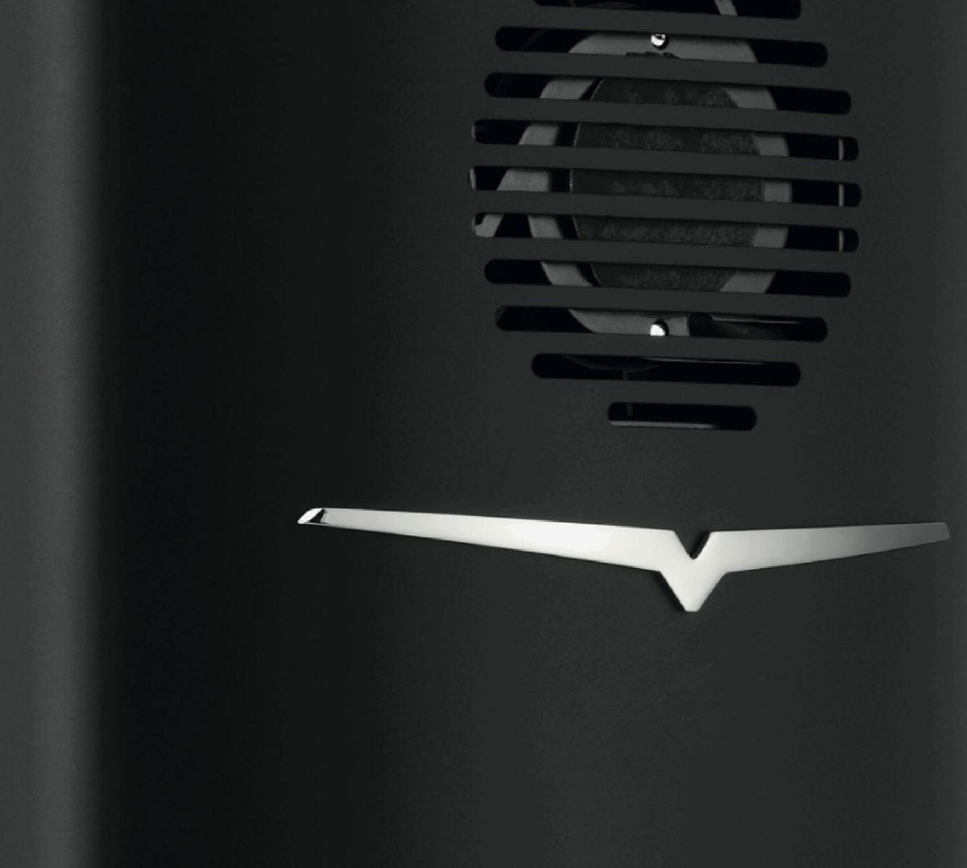 Close-up of the metal wing on the black body of a Victoria Arduino espresso machine